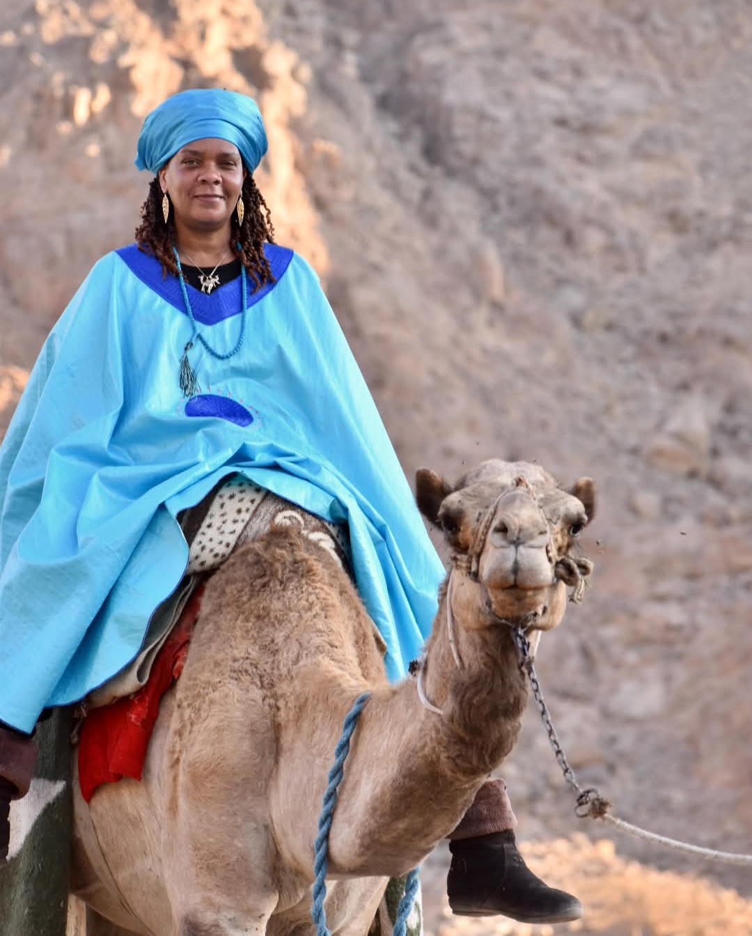 Dr. Noelle Hunter riding a camel